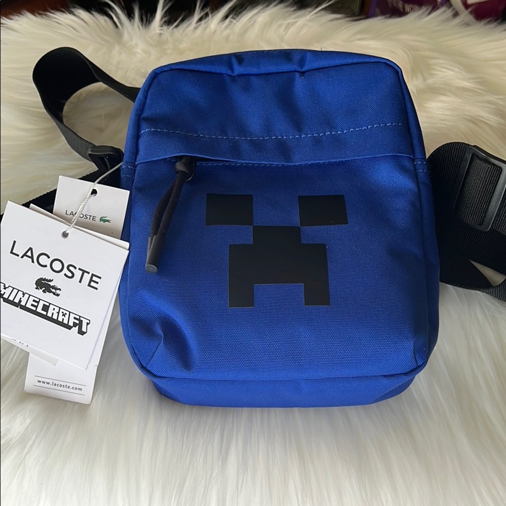 Lacoste Blue Crossbody Bag with Black Strap and Pixelated Design